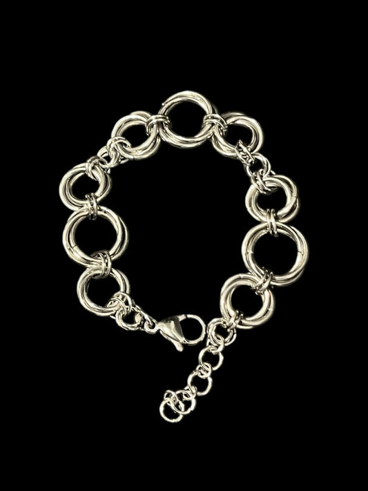 Silver chain bracelet on a black background