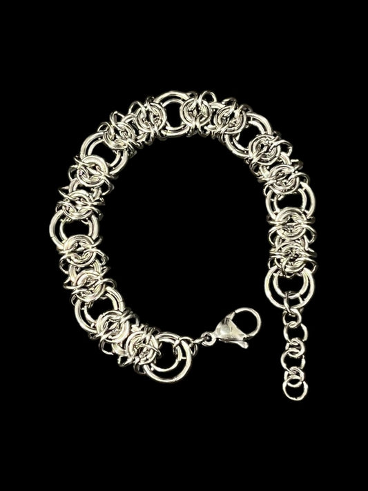 Silver chain bracelet on a black background